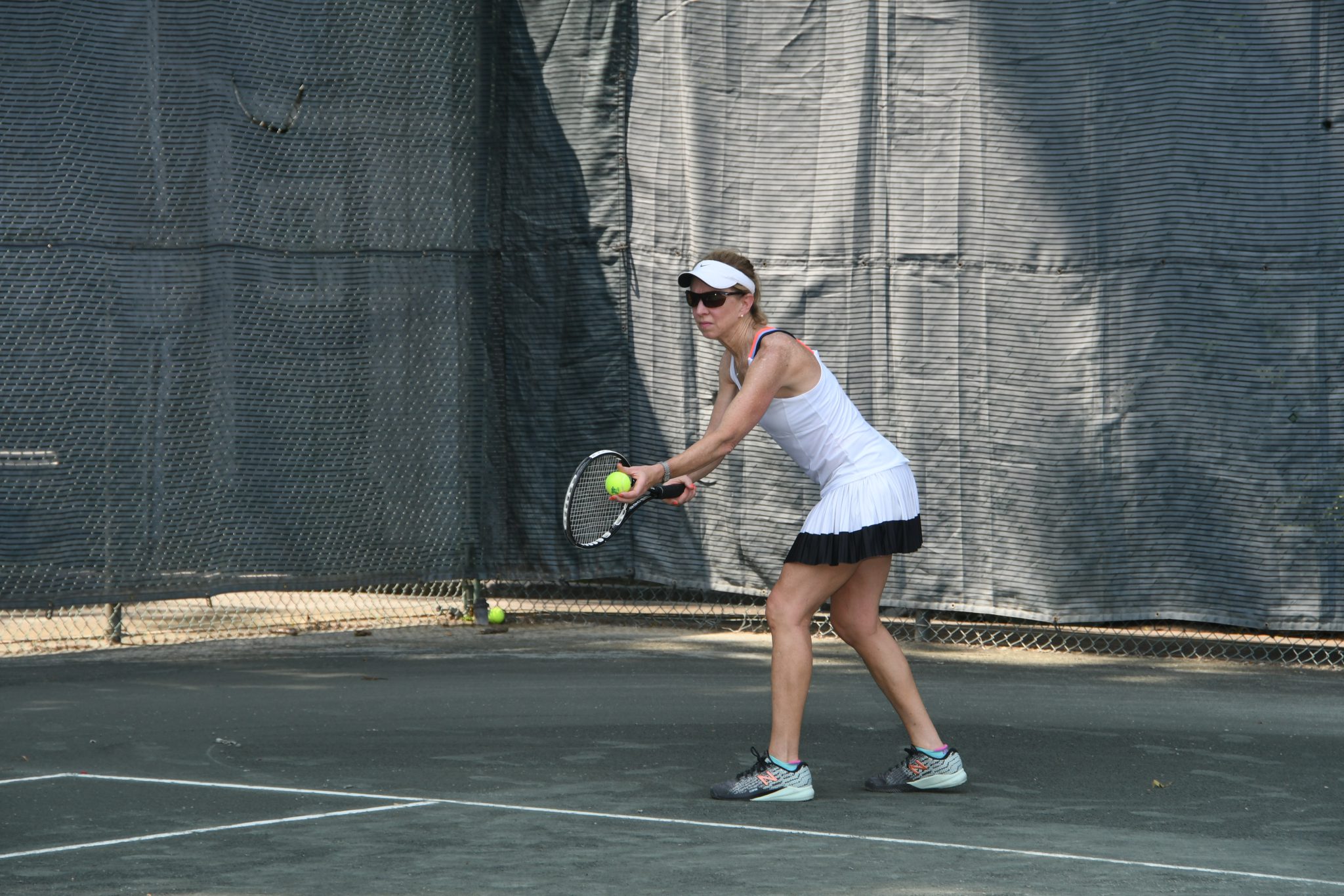 Displaying A tennis player readies her serve.JPG